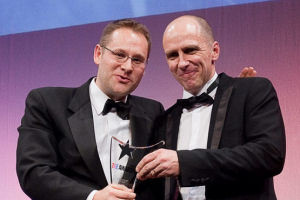 Professor James Thompson receives the award from THE's Phil Baty