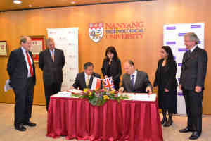 Professor Colin Bailey (seated, right) signs the Memorandum of Understanding