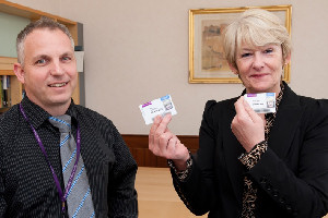 The President receiving her new staff card