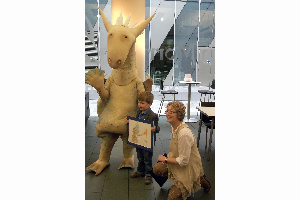 Grumbold the dragon, with winner Max Rose and artist Melanie Allen