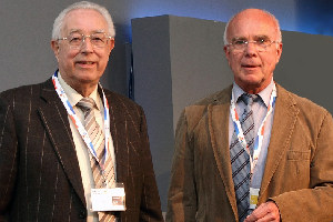 Prof Bob Stepto (left) receives the prize from Prof Goerg H Michler