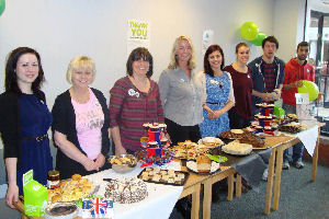 Staff in the Kilburn Building line up behind their goodies