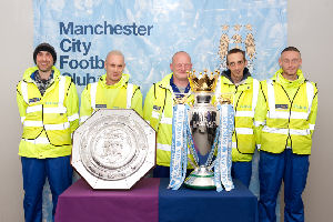 The Univalet team with Manchester City's Premier League Trophy