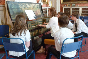 Pupils from Lymm High School receiving a virginal tutorial from Charlotte Turner