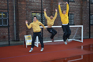 Three men jumping in the air