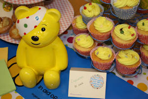 Pudsey Bear with cupcakes