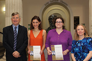 Sir Martin Harris presents prizes to Catherine Belcher and Elizabeth Gibson.