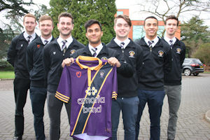 Hockey team with newly branded shirt