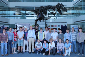 Group in front of a T-Rex skeleton