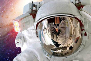 Close up of astronaut helmet reflecting space 