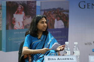 Bina Agarwal at a desk