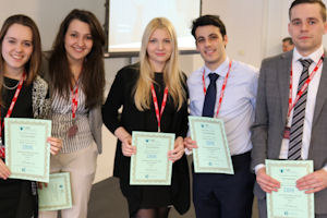 Group standing with their certificates 