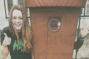 Image of student with friend dressed in a bin suit 