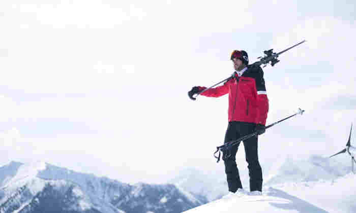 Man on snowy mountain top