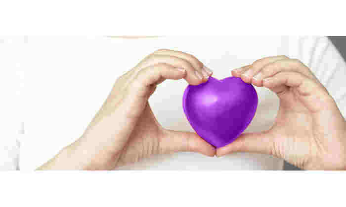 Holding heart in purple