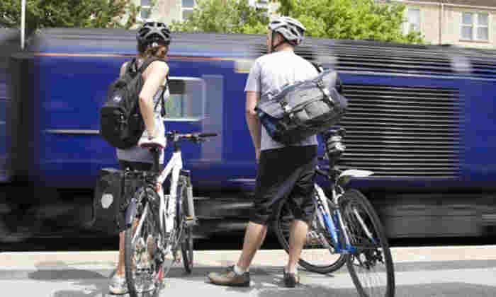 Cyclists waiting for a train