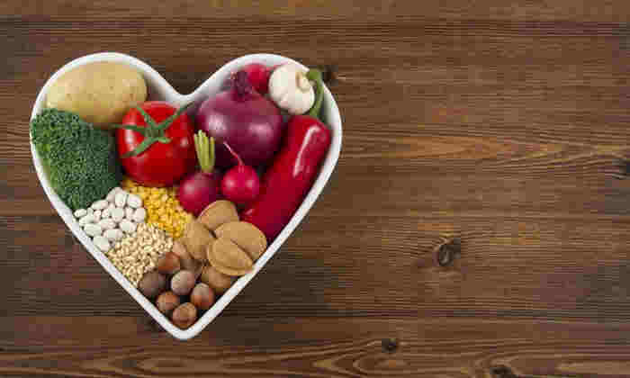 Healthy food in heart shaped bowl