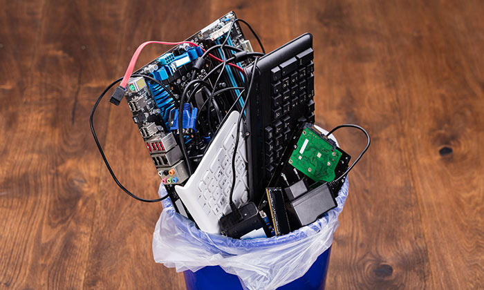 Old computer hardware in a bin