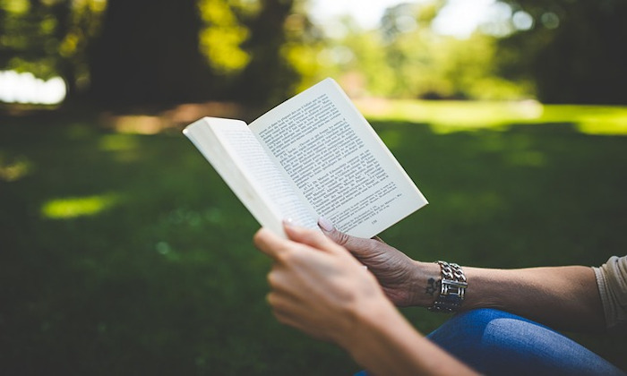 Hands holding a book