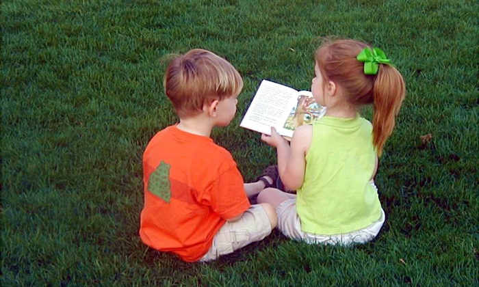 Two children and a book