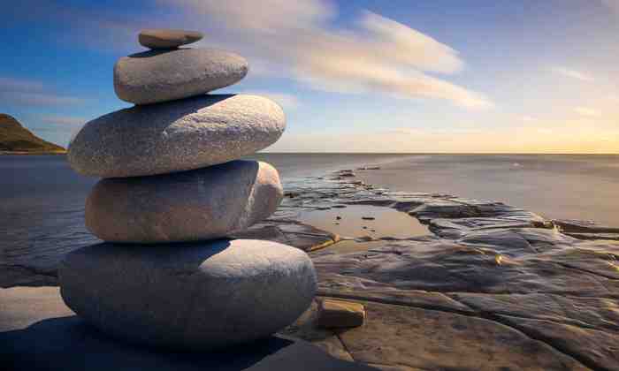 Stones balanced on beach