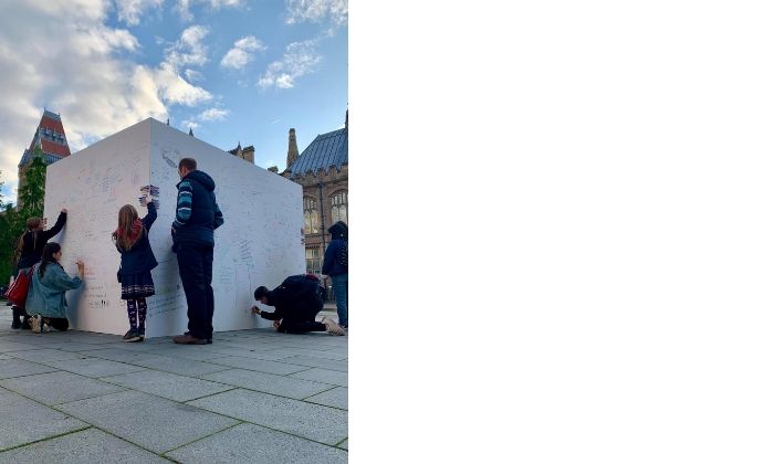 Students drawing on the Big White Wall