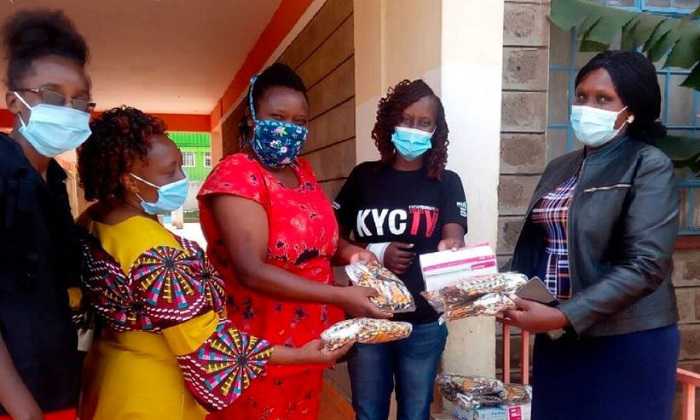 People in Kenya wearing masks who are benefitting from this research