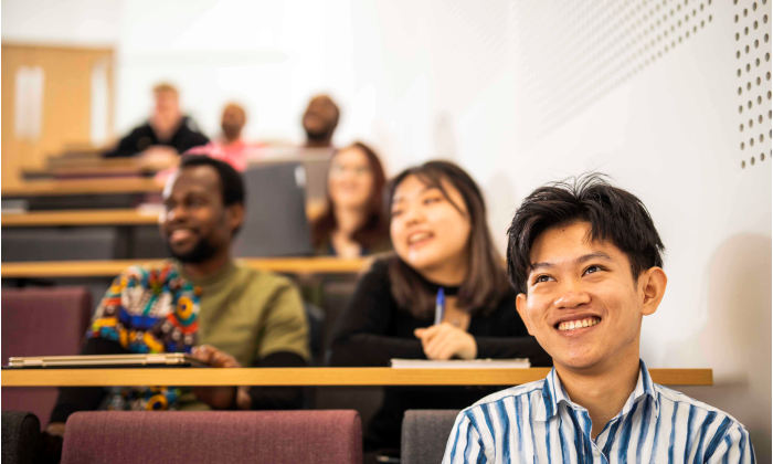 student smiles in lecture
