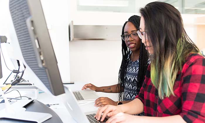 Two students using computer