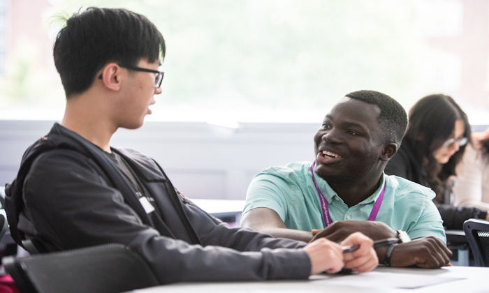 A colleague talking to a student