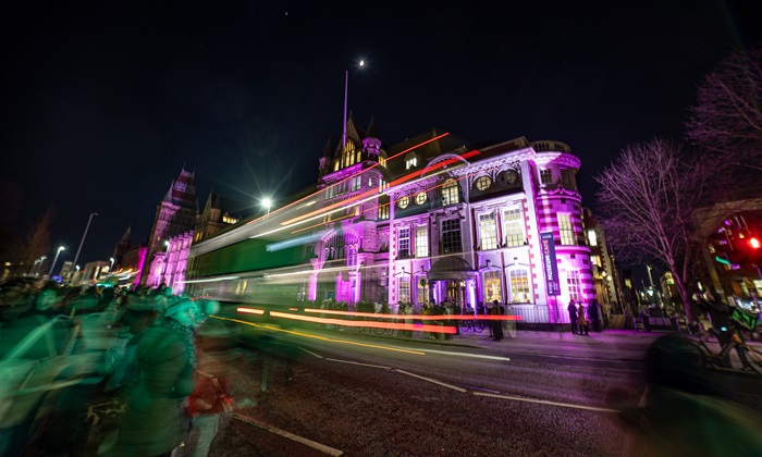 Manchester Museum lit up purple