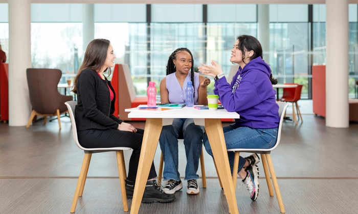 Students talking at table