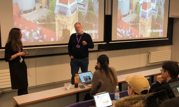 Martin Banks delivering a guest talk in a lecture theatre.