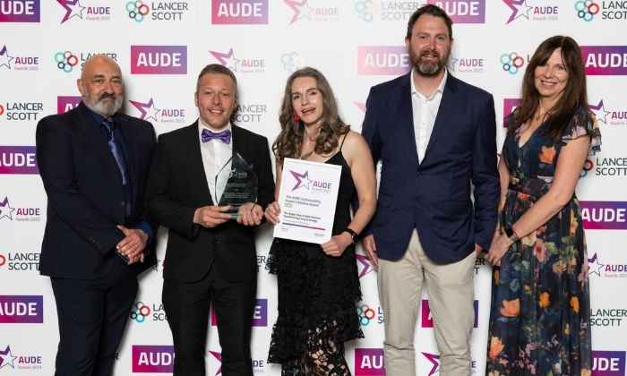 Our team holding their award