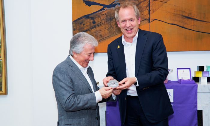 Gian being presented with award from Duncan