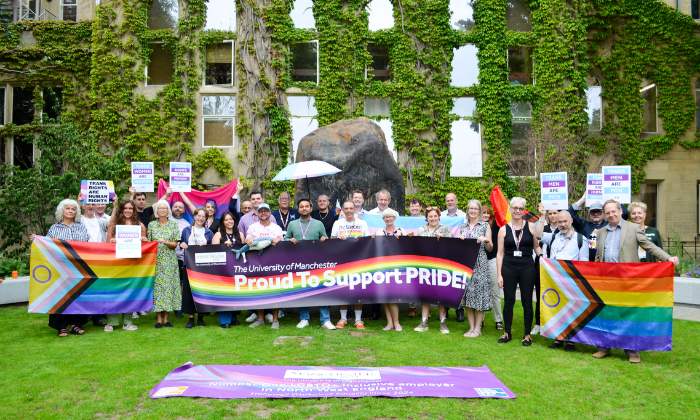 UoM colleagues outside the Uni with pride flags