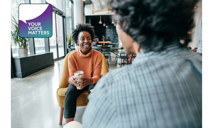 Image of two colleagues talking and Your Voice Matters icon