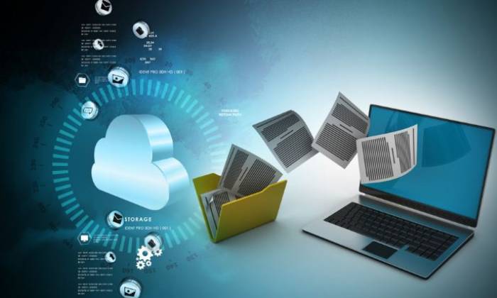 Animation of folders flying into a laptop screen with technology around it 