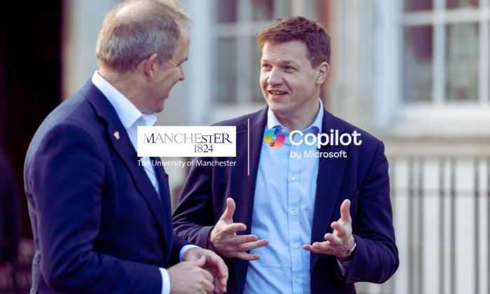 Two men walk and talk 