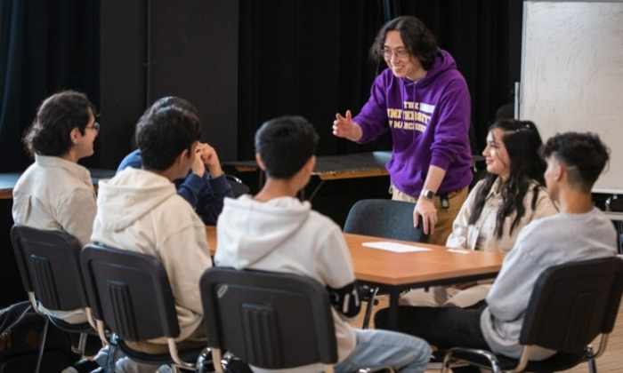 University of Manchester student talking to school students