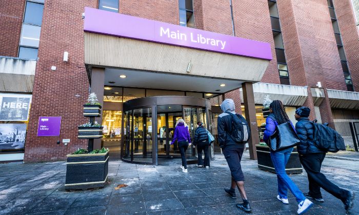 Students walking into Main Library