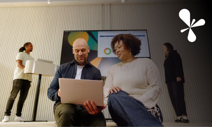 Image showing two colleagues looking at a laptop