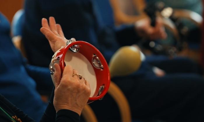 Playing the tambourine at Music in Mind