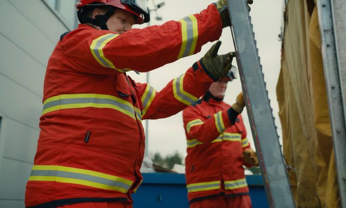 Firefighters moving equipment