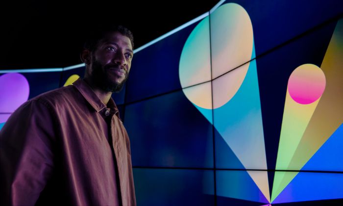 Man smiling near a strategy digital image